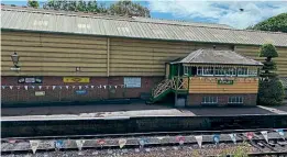  ?? ?? Left of the signalbox are the metals signs that were stolen from Ropley. MHR