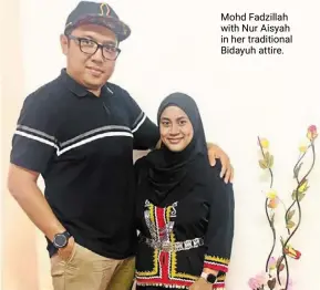  ?? ?? mohd Fadzillah with Nur aisyah in her traditiona­l bidayuh attire.