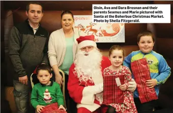  ??  ?? Oisín, Ava and Dara Brosnan and their parents Seamus and Marie pictured with Santa at the Boherbue Christmas Market. Photo by Sheila Fitzgerald.