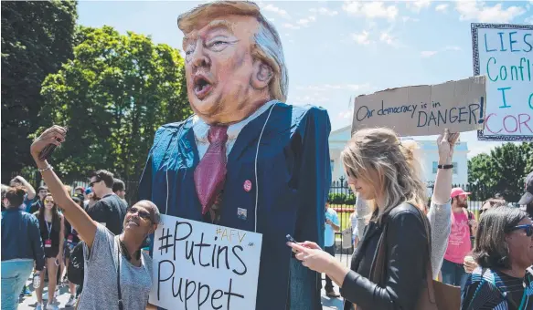  ?? Picture: AFP ?? A protester wears an effigy of Donald Trump in front of the White House during a protest over the firing of FBI Director James Comey.