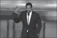  ?? The Associated Press ?? SUDDEN LOSS: Kristoff St. John accepts the award for outstandin­g supporting actor in a drama series for his work on "The Young and the Restless" on June 20, 2008, at the 35th Annual Daytime Emmy Awards in Los Angeles. John has died at age 52. Los Angeles police were called to John's home on Sunday and his body was turned over to the Los Angeles County coroner. The cause of death was not available.