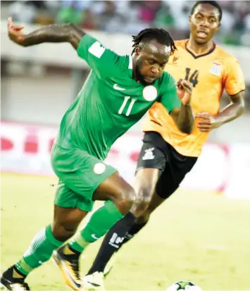  ??  ?? Victor Moses (left) outruns Zambia’s Enoch Mwepu during the FIFA World Cup 2018 qualifying match between the Super Eagles and the Chipolopol­o in Uyo last year. Moses announced his retirement from internatio­nal football…on Wednesday. PHOTO: AFP