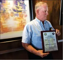  ?? Buy this photo at YumaSun.com PHOTO BY MARA KNAUB/YUMA SUN ?? JAMES “JIM” MCDERMOTT, LONGTIME PILOT, flight instructor and airplane mechanic, accepts the Wright Brothers Master Pilot Award for more than 50 years of safe flying. He also received the Charles Taylor Master Mechanic Award on June 15.