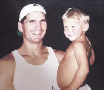  ?? Pederson family ?? FORMER DODGER Stu Pederson holds his young son Joc in an old family photo; Joc Pederson, now 23, is the starting center fielder for the Dodgers who has impressed people with his skills and humility.