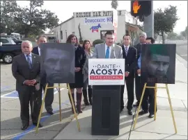  ?? Kevin Kenney/The Signal ?? Republican Assembly candidate Dante Acosta, center, speaks at a news conference Monday outside Democratic headquarte­rs in Newhall.