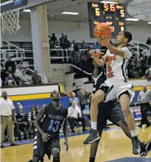  ?? LARRY KANE/FOR THE SUN-TIMES ?? Morgan Park’s Billy Garrett (above) formed a solid senior backcourt with Kyle Davis during the 2013 season.