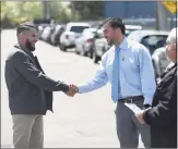  ?? Tyler Sizemore / Hearst Connecticu­t Media ?? Republican state representa­tive candidate J.D. Ospina, right, outside District 9 polling center.