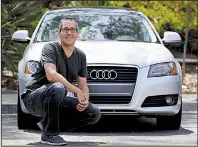  ?? AP/CHRIS CARLSON ?? Keith Reynolds of Laguna Hills, Calif., drives a 9-year-old Audi A3 compact car, but is on the waiting list for Tesla’s Model 3.