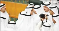  ?? KUNA photo ?? MP Ahmad Al-Saadoun being surrounded by some other MPs after he was elected by acclamatio­n as the new Speaker.