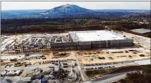  ?? CONTRIBUTE­D ?? Constructi­on continues on a new Amazon fulfillmen­t center in Gwinnett County. The center is expected to employ 1,000 people. It’s likely that Atlanta’s bid in 2018 for Amazon’s second HQ kept the city on the radar of the world’s largest retailer.