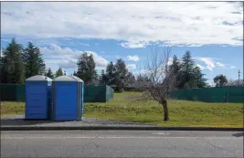  ?? PHOTOS BY MICHAEL WEBER — ENTERPRISE-RECORD ?? Two portable toilets are placed on gravel near two areas marked by fencing for Chico’s alternate shelter sites seen Friday in Chico.