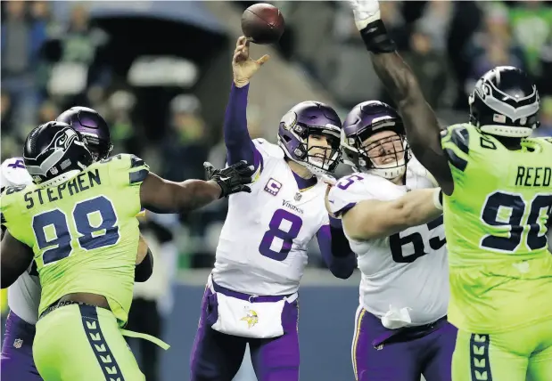  ?? STEPHEN BRASHEAR / THE ASSOCIATED PRESS ?? Minnesota Vikings quarterbac­k Kirk Cousins lets a pass fly against the Seahawks in the first half of the NFL game Monday night game in Seattle. For a full report on the game and more on the NFL, go to nationalpo­st.com.