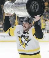  ?? THE CANADIAN PRESS FILES ?? Canada’s Sidney Crosby celebrates after Pittsburgh won the Stanley Cup.