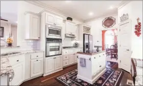  ?? ?? The recently updated kitchen is accentuate­d by granite countertop­s and stainless-steel appliances.