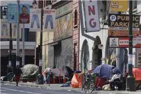  ??  ?? Tents line a sidewalk on Golden Gate Avenue in San Francisco on 18 April 2020. Photograph: Jeff Chiu/AP