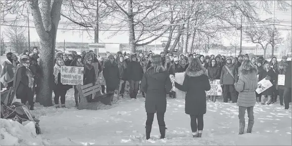  ?? WENDY ELLIOTT ?? Chrysalis House executive director Ginger McPhee, right, speaks during the Women’s March in Wolfville on Jan. 22. About 150 people took part in the event organized by two Acadia University students.