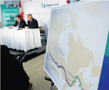  ?? JEFF McINTOSH / THE CANADIAN PRESS ?? TransCanad­a CEO Russ Girling, right, and TransCanad­a president of energy and oil pipelines Alex Pourbaix announce the company is moving forward with the 1.1 million barrel-per- day Energy East Pipeline project in 2013.