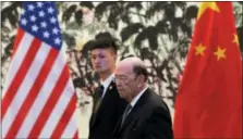  ?? THE ASSOCIATED PRESS ?? U.S. Commerce Secretary Wilbur Ross arrives at the Diaoyutai State Guesthouse to attend a meeting with Chinese Vice Premier Liu He in Beijing on Sunday.