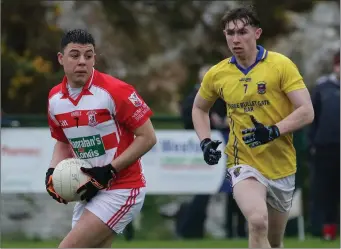  ??  ?? Adam Baziz of St. Mary’s (Maudlintow­n) has time on his side as Michael Cullen (GOH) looks on.