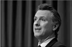  ?? AP Photo/Rich Pedroncell­i ?? In this Jan. 8 file photo, California Gov. Gavin Newsom outlines his 2021-2022 state budget proposal during a news conference in Sacramento, Calif.