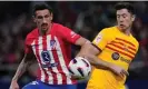  ?? Photograph: Bernat Armangué/AP ?? Barcelona’s Robert Lewandowsk­i (right) vies for the ball with Atlético Madrid’s Stefan Savic.