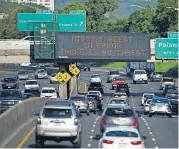  ?? [PHOTO BY ANTHONY QUINTANO, CIVIL BEAT VIA AP] ?? Cars drive past a highway sign that says “MISSILE ALERT ERROR THERE IS NO THREAT” on the H-1 Freeway in Honolulu. State emergency officials announced human error as cause for a statewide announceme­nt of an incoming missile strike alert that was sent to...