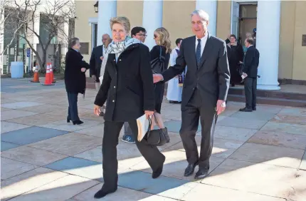  ??  ?? Robert Mueller and his wife, Ann, leave St. John’s Episcopal Church, across from the White House.