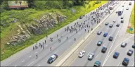  ?? Patrick Sikes / For Hearst Connecticu­t Media ?? Protesters stop traffic Sunday on Interstate 95 in Norwalk.