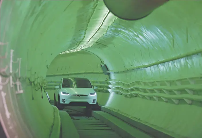  ?? Robyn Beck / AFP ?? Elon Musk, co-founder of Tesla, arrives at an event in a modified Tesla Model X electric vehicle in a test tunnel near Los Angeles in 2018.