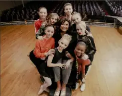  ?? Annie O’Neill ?? Abby Lee Miller, center, with the season eight dancers of "Dance Moms." Kamryn Smith is pictured at lower right.