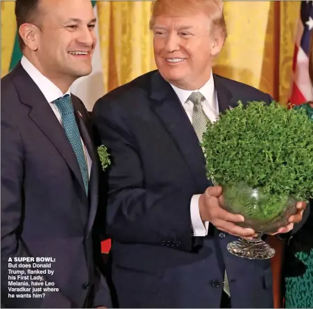  ??  ?? a super bowl: But does Donald Trump, flanked by his First Lady, Melania, have Leo Varadkar just where he wants him?