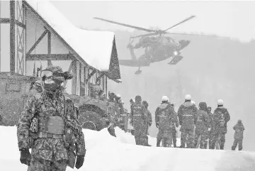  ?? — AFP photo ?? A helicopter from Japan’s Self-Defence Force (JSFD) is seen at a ski resort during a rescue operation after the volcanic eruption of Mount Kusatsu-Shirane in Kusatsu town, Gunma prefecture.