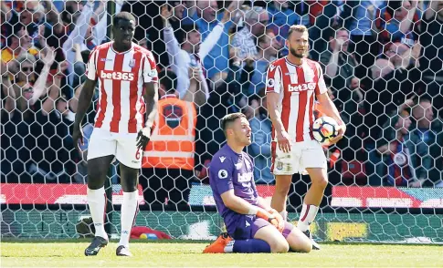  ??  ?? Stoke City goalkeeper Jack Butland (centre) reacts after Crystal Palace’s Patrick van Aanholt scores his side’s second goal of the game, during the English Premier League match between Stoke City and Crystal Palace, at the bet365 Stadium, in Stoke,...