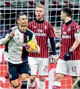  ?? — AFP ?? Cristiano Ronaldo (left) of Juventus celebrates after scoring a penalty against AC Milan in their Italian Cup semifinal first leg match at the San Siro Stadium in Milan on Thursday.