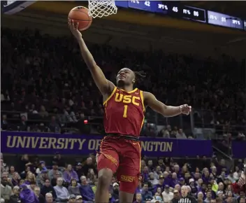  ?? JOHN FROSCHAUER — THE ASSOCIATED PRESS ?? USC guard Isaiah Collier goes in for an unconteste­d layup during Saturday’s victory over Washington in Seattle.