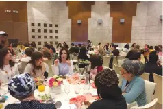  ?? (Temech) ?? ULTRA-ORTHODOX WOMEN network at the Jerusalem Internatio­nal Convention Center yesterday.