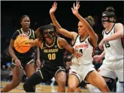  ?? POWERS IMAGERY — PAC-12 ?? Colorado’s Jaylyn Sherrod is defended by Oregon State’s Donovyn Hunter during the quarterfin­als of the Pac-12 women’s basketball tournament on March 7 at MGM Grand Garden Arena in Las Vegas.