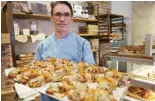  ?? ?? French pastry chef Stephane Louvard poses with his “Crookies”, a traditiona­l French croissant mixed with cookie dough, in his pastry shop in Paris.