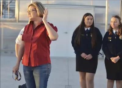  ??  ?? SHS FFA Teacher Kristin Mayo accompanie­d by some of the El Centro FFA officer (background) talks about the main features of the Greenhouse during a tour on Thursday. EDWIN