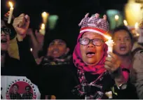  ?? Achmad Ibrahim / AP Photo ?? Supporters of Basuki Purnama, who is in jail for blasphemy, protest outside the high court in Jakarta.