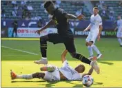  ?? John McCoy Getty Images ?? JOSE CIFUENTES of LAFC jumps over a defender during the first half at Dignity Health Sports Park.