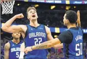  ?? JOHN RAOUX Associated Press ?? FRANZ WAGNER celebrates with Magic teammate Cole Anthony during a 34-point, 13-rebound effort.