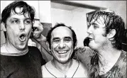  ?? AP 1973 ?? Mets pitcher Tug McGraw tugs the ear of Tom Seaver as they celebrate with manager Yogi Berra in the locker room in Chicago after beating Chicago Cubs 6-4 to win the 1973 National League East pennant.