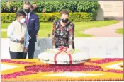  ?? —ANI ?? Denmark Prime Minister Mette Frederikse­n pays a tribute to Mahatma Gandhi at Rajghat in New Delhi on Saturday.