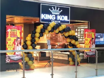  ??  ?? A balloon arch is seen at the entrance of King Koil’s showroom.