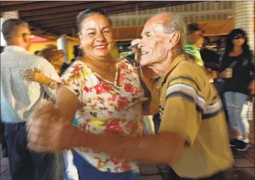  ?? Photograph­s by Carolyn Cole Los Angeles Times ?? FOR TWO decades, La Gozadera has been a place for locals to dance, drink, eat and have a good time.