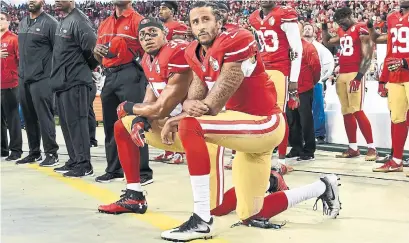  ?? THEARON W. HENDERSON/GETTY IMAGES ?? Then-49ers quarterbac­k Colin Kaepernick, left, and strong safety Eric Reid began an inequality protest during the national anthem in 2016. Neither has been signed by another team in an example of the sports industry ostracizin­g Black athletes who...