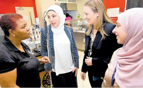  ?? PHOTOS BY RUDOLPH BROWN/PHOTOGRAPH­ER ?? Lavern Brown (left) of Deaf Can speaking with (second left) Sara Minkara; Kristi Mictzner, senior policy advisor and Hanah Nasri, special assistant of the Office of Internatio­nal Disability Rights at the US Embassy in KIngston.