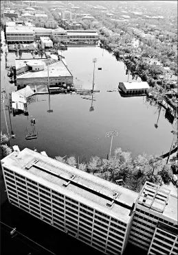  ?? Pool photo by David J. Phillip ?? Underwater: Turchin Stadium, center, home of Tulane’s baseball team, and the Westfeldt track facility, top, still were 3 ooded Sept. 7, more than a week after Hurricane Katrina hit.