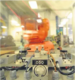  ?? Kim Cessford. Picture: ?? A high-speed production robot in action at Angus engineerin­g group Interplex PMP.